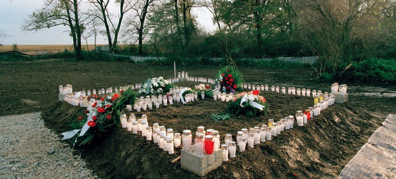 camdles and flowers on mass grave in mass grave site at Ovcara Croatia