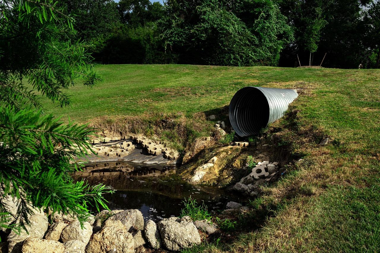 sewage pipe polluted water, environmental, erosion