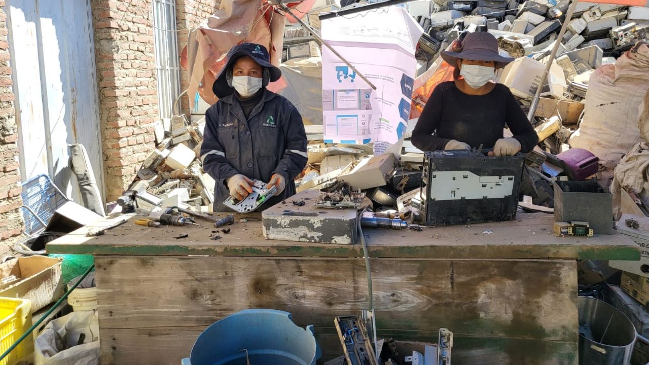 Two e-waste workers in Bolivia