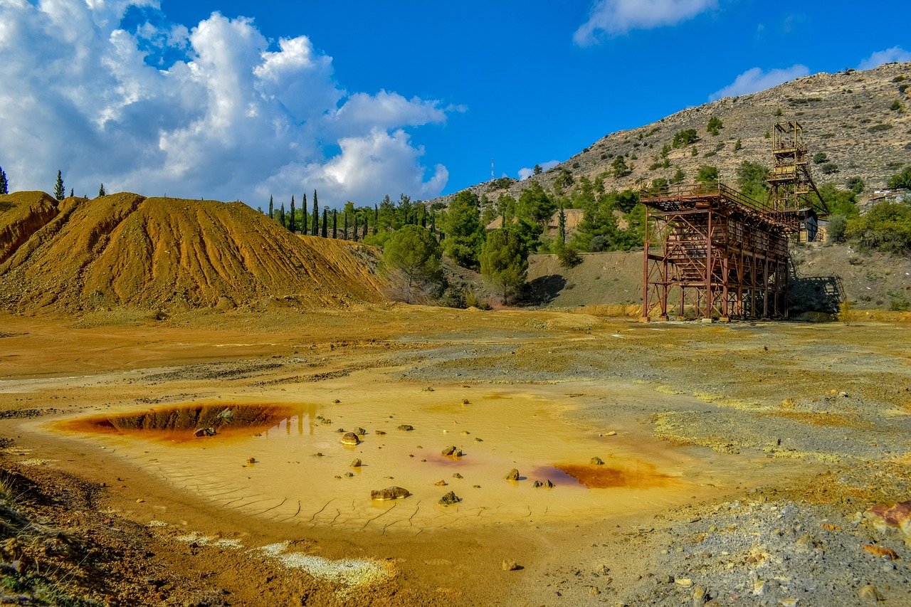 an abandoned mine leaving behind environmental pollution