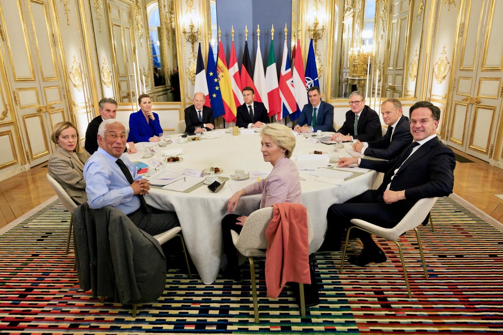 EU politicians meeting in Paris, sitting at a round table